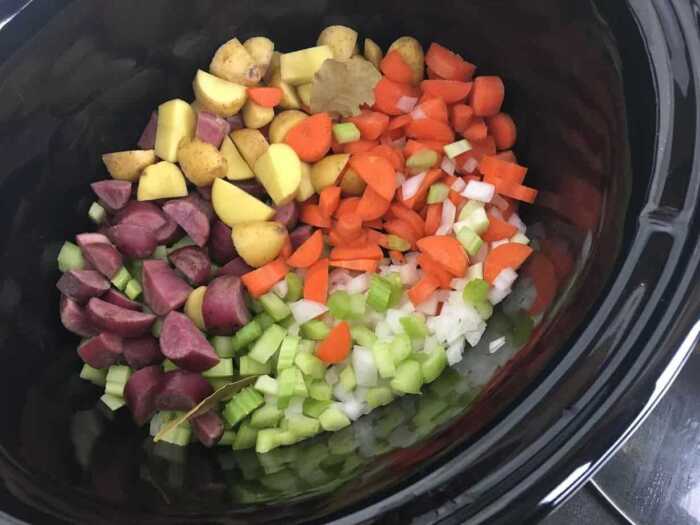 chopped vegetables in a crock pot